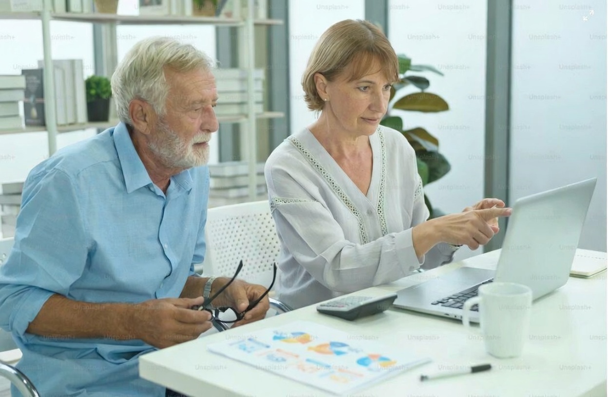 Professional couple reviewing estate planning documents